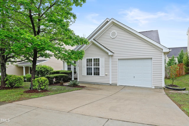 3108 Forrestal Dr, Durham, NC 27703 - view of front facade with driveway, an attached garage, and fence