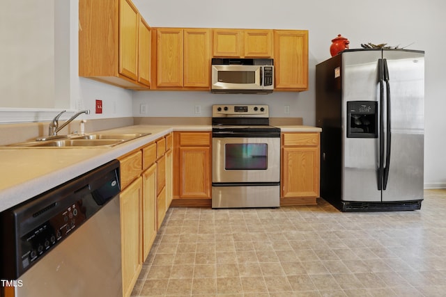 3108 Forrestal Dr, Durham, NC 27703 - kitchen featuring stainless steel appliances, a sink, and light countertops