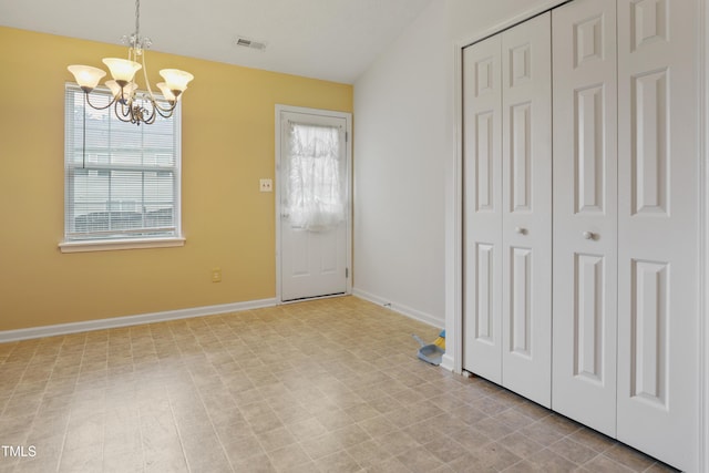 3108 Forrestal Dr, Durham, NC 27703 - unfurnished dining area with a chandelier, baseboards, and tile patterned floors
