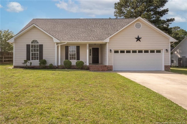 551 Hobson Rd, Raeford, NC 28376 - single story home featuring concrete driveway, roof with shingles, a garage, and a front yard