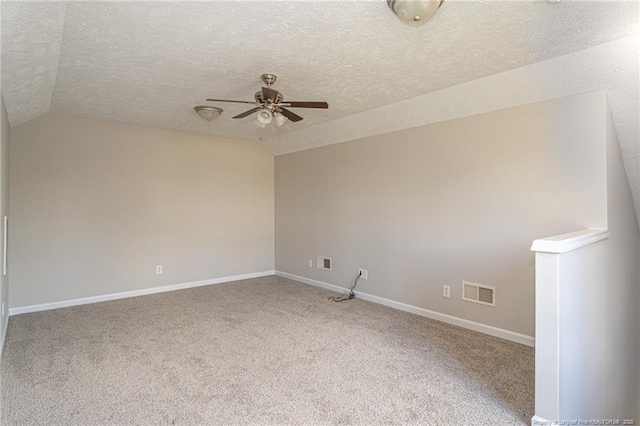 551 Hobson Rd, Raeford, NC 28376 - carpeted spare room featuring ceiling fan, a textured ceiling, vaulted ceiling, and baseboards