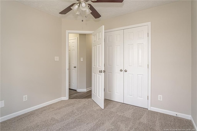 551 Hobson Rd, Raeford, NC 28376 - unfurnished bedroom with carpet floors, a closet, baseboards, a textured ceiling, and a ceiling fan