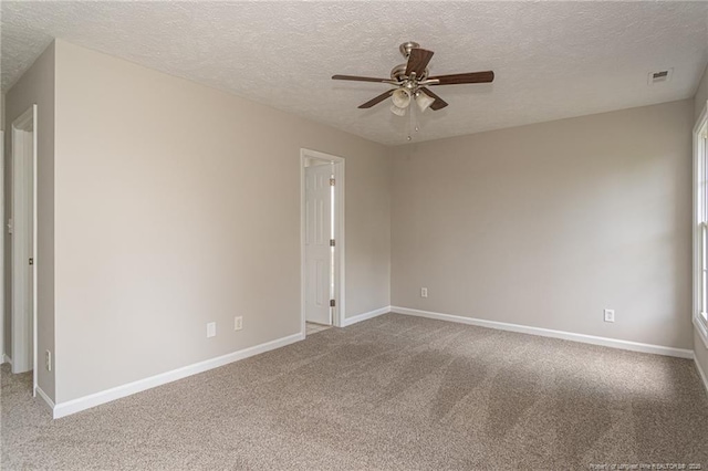 551 Hobson Rd, Raeford, NC 28376 - spare room with carpet floors, ceiling fan, a textured ceiling, and baseboards