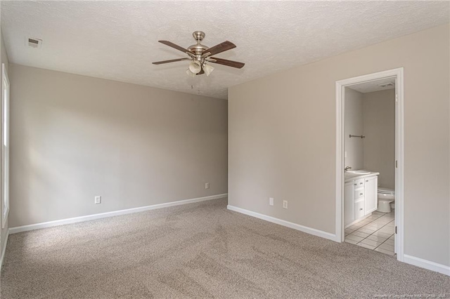 551 Hobson Rd, Raeford, NC 28376 - unfurnished room with ceiling fan, light colored carpet, baseboards, a textured ceiling, and a sink