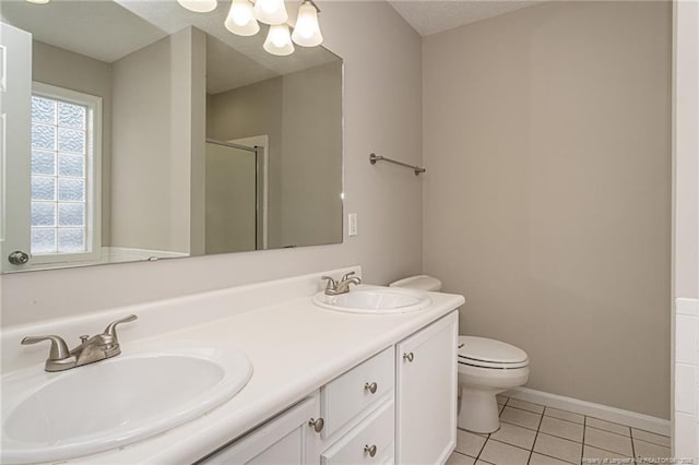 551 Hobson Rd, Raeford, NC 28376 - full bathroom featuring a stall shower, double vanity, tile patterned floors, a chandelier, and toilet