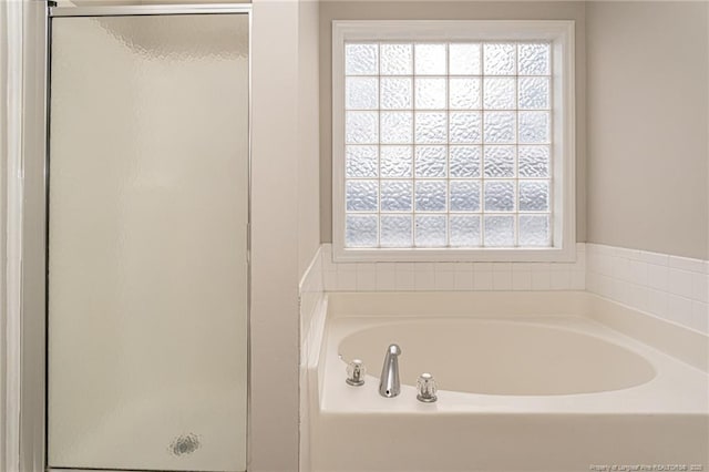 551 Hobson Rd, Raeford, NC 28376 - bathroom featuring a shower stall, plenty of natural light, and a bath