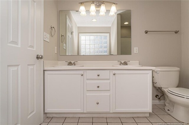551 Hobson Rd, Raeford, NC 28376 - bathroom with tile patterned floors, toilet, a chandelier, and double vanity