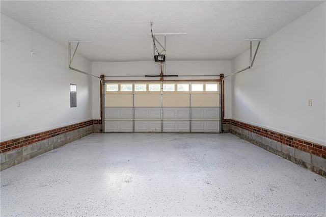 551 Hobson Rd, Raeford, NC 28376 - garage with a garage door opener, a wainscoted wall, and electric panel