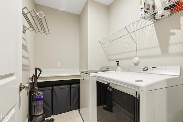 127 Manordale Dr, Chapel Hill, NC 27517 - clothes washing area with washing machine and dryer and light tile patterned floors