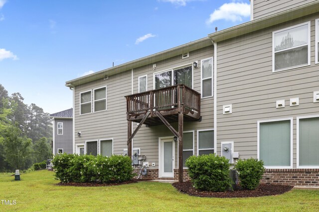 127 Manordale Dr, Chapel Hill, NC 27517 - rear view of house featuring a lawn, a balcony, and brick siding