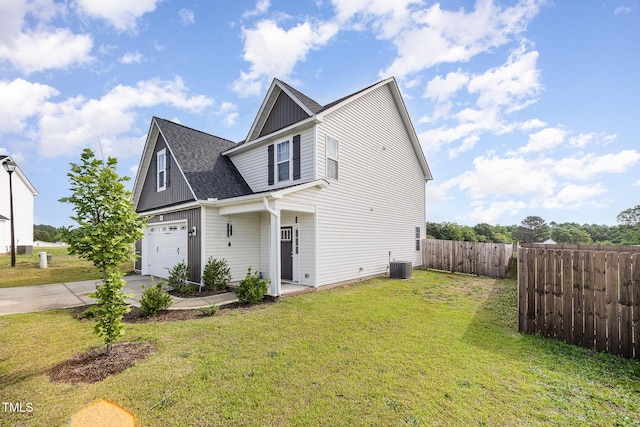 view of front of home featuring central AC unit, driveway, board and batten siding, and a shingled roof