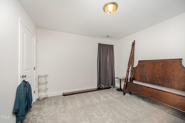 carpeted bedroom with baseboards