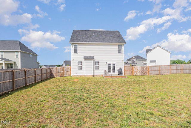 back of property with a deck and french doors