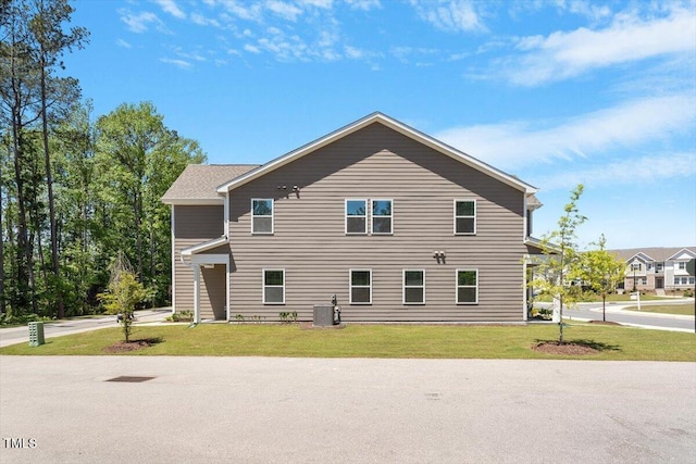1440 Latham Garden Dr, Wake Forest, NC 27587 - view of side of property with central AC and a lawn
