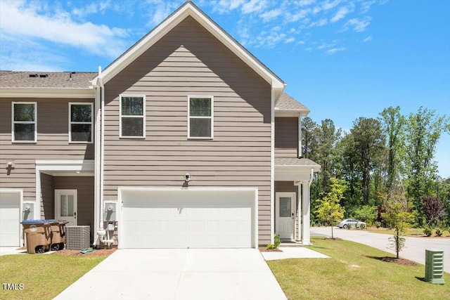 1440 Latham Garden Dr, Wake Forest, NC 27587 - view of front of house featuring a garage, a front lawn, driveway, and central AC unit