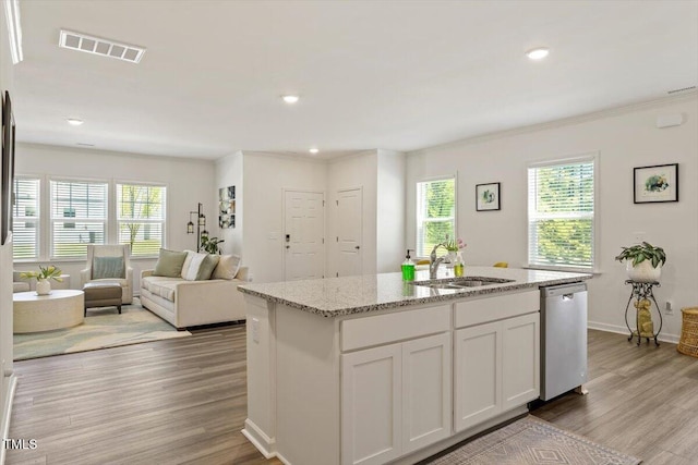 1440 Latham Garden Dr, Wake Forest, NC 27587 - kitchen with dishwasher, a sink, light wood-style flooring, healthy amount of natural light, and recessed lighting