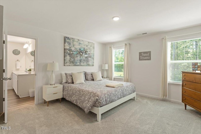 1440 Latham Garden Dr, Wake Forest, NC 27587 - bedroom with light carpet, baseboards, and a sink
