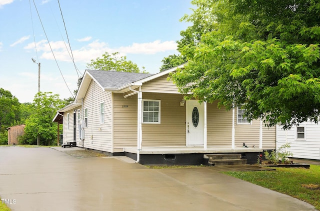 1309 Jackson St, Burlington, NC 27217 - view of front of property with a porch, concrete driveway, and crawl space