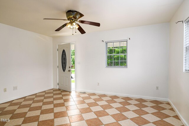 1309 Jackson St, Burlington, NC 27217 - spare room with a ceiling fan and baseboards