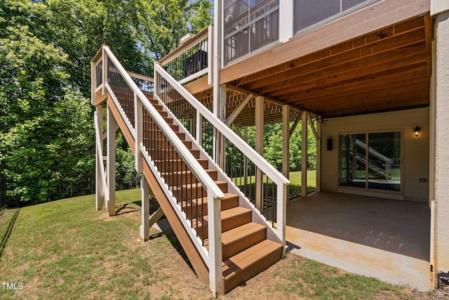 view of patio with stairs and a deck