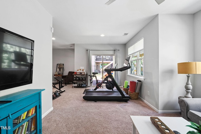 exercise area featuring carpet floors, baseboards, and recessed lighting