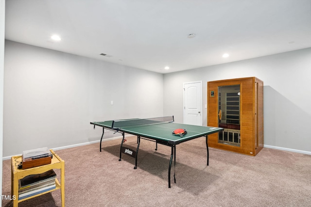 recreation room featuring light colored carpet, recessed lighting, and baseboards