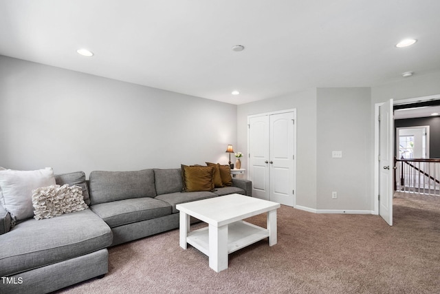 living area with recessed lighting, carpet, and baseboards