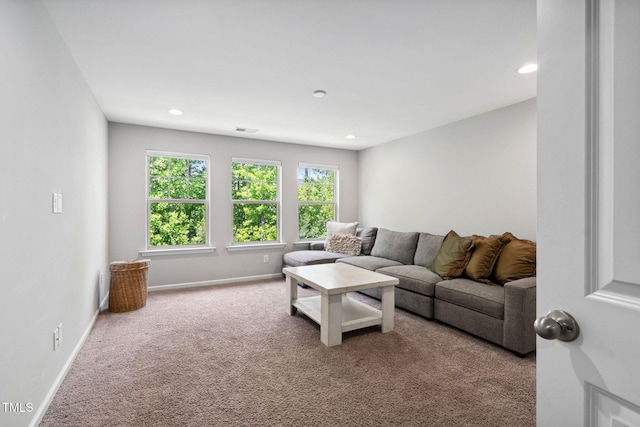 carpeted living room featuring recessed lighting and baseboards
