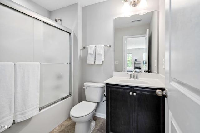 full bath featuring vanity, toilet, and enclosed tub / shower combo