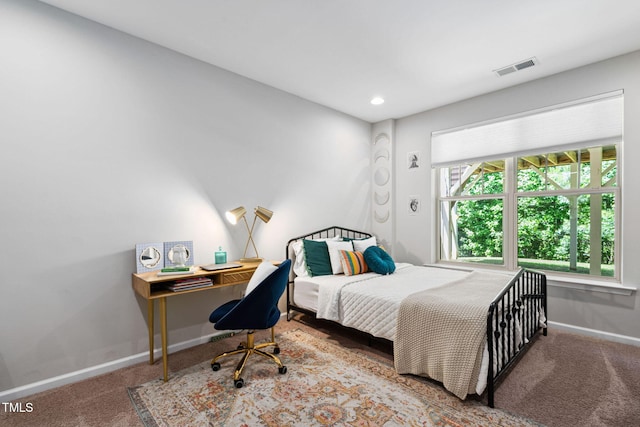 carpeted bedroom with baseboards, recessed lighting, and a desk