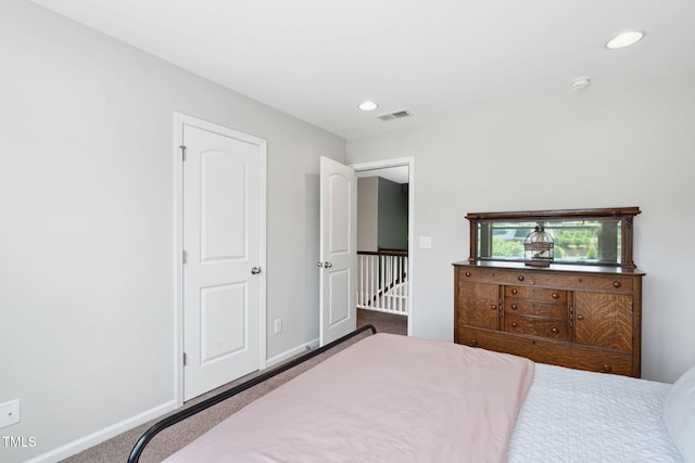 bedroom with carpet floors, recessed lighting, and baseboards