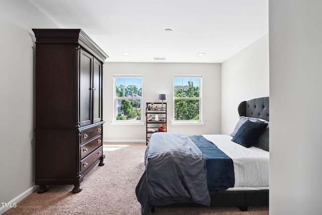 carpeted bedroom with baseboards and recessed lighting