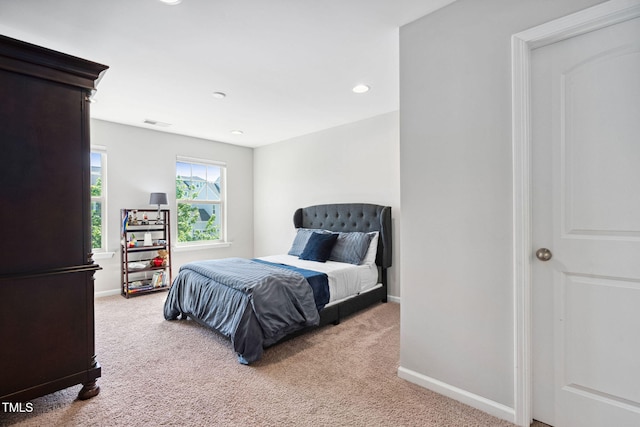 bedroom with light carpet, baseboards, and recessed lighting