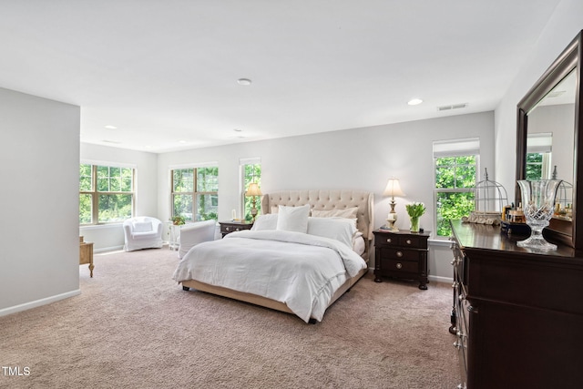 bedroom featuring light carpet, baseboards, and recessed lighting