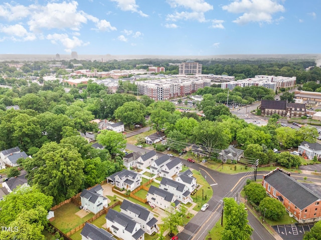 view of urban area featuring a tree filled landscape