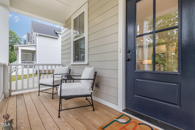 entrance to property featuring a porch