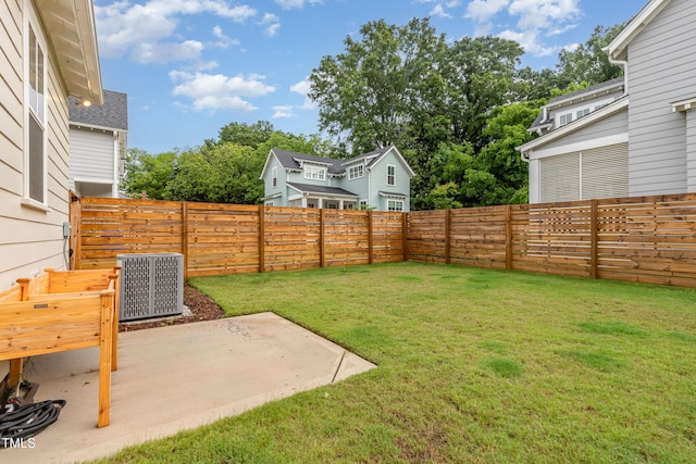 view of yard with cooling unit and a patio area