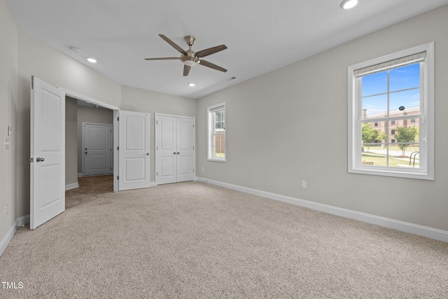 986 Gateway Commons Cir, Wake Forest, NC 27587 - unfurnished bedroom with baseboards, multiple windows, carpet, recessed lighting, and a closet
