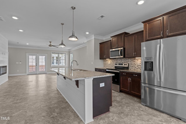 986 Gateway Commons Cir, Wake Forest, NC 27587 - kitchen featuring stainless steel appliances, recessed lighting, crown molding, ceiling fan, and a sink