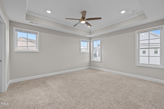 986 Gateway Commons Cir, Wake Forest, NC 27587 - spare room with a tray ceiling, ornamental molding, a ceiling fan, carpet, and baseboards