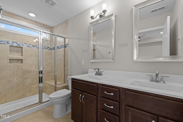 986 Gateway Commons Cir, Wake Forest, NC 27587 - bathroom with a shower stall, toilet, double vanity, and tile patterned floors