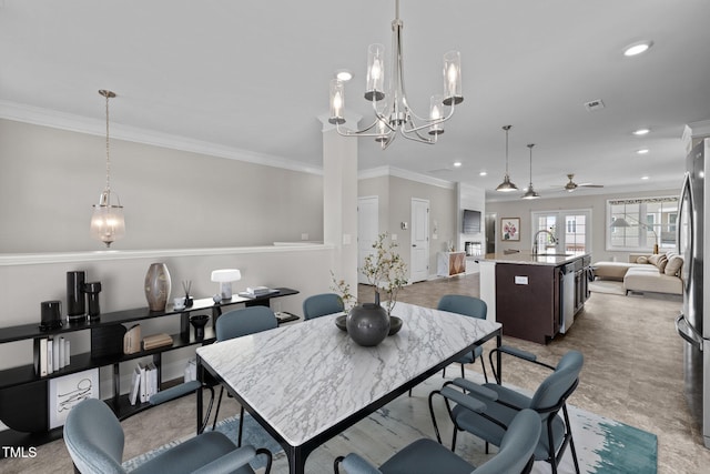 986 Gateway Commons Cir, Wake Forest, NC 27587 - dining space with ornamental molding, a ceiling fan, recessed lighting, and a chandelier