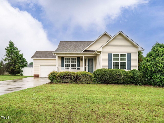 253 Middle Landing Dr, Smithfield, NC 27577 - view of front of house featuring a porch, concrete driveway, a garage, and a shingled roof