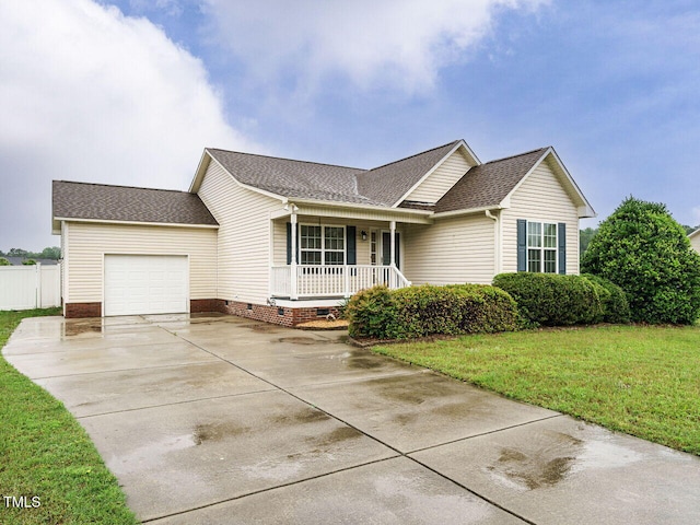 253 Middle Landing Dr, Smithfield, NC 27577 - ranch-style home featuring covered porch, a garage, driveway, and a shingled roof