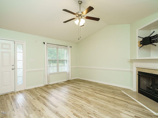 253 Middle Landing Dr, Smithfield, NC 27577 - unfurnished living room featuring lofted ceiling, ceiling fan, wood finished floors, a high end fireplace, and baseboards