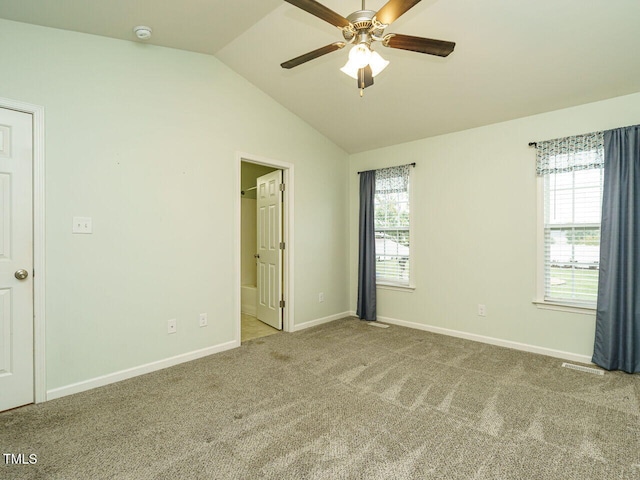 253 Middle Landing Dr, Smithfield, NC 27577 - unfurnished bedroom with carpet flooring, lofted ceiling, baseboards, ensuite bathroom, and a ceiling fan