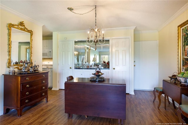 1100 Clarendon St Unit 501, Fayetteville, NC 28305 - interior space featuring a chandelier, dark wood-style flooring, ornamental molding, and baseboards