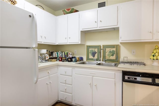 1100 Clarendon St Unit 501, Fayetteville, NC 28305 - kitchen with white appliances, a sink, light countertops, and white cabinetry