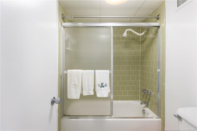 1100 Clarendon St Unit 501, Fayetteville, NC 28305 - full bathroom featuring bath / shower combo with glass door and toilet