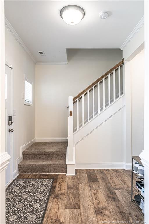 527 Weston Woods St, Raeford, NC 28376 - staircase with ornamental molding, wood finished floors, and baseboards
